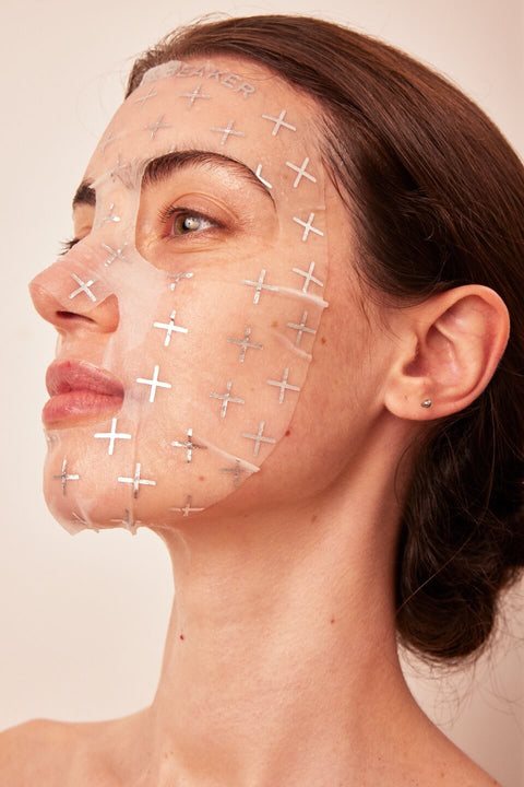 Woman with Lemon & Beaker Brightening Face Mask applied to her face