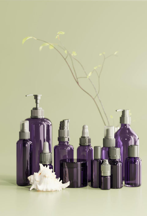A collection of violet-colored cosmetic bottles.